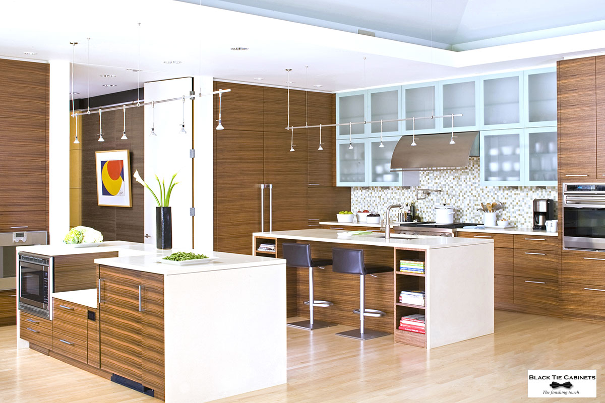 Contemporary walnut kitchen with matching wood grain.